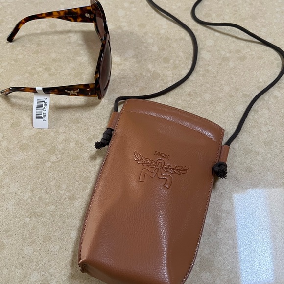 MCM Tortoise Shell Sunglasses with Gold Accent tag on